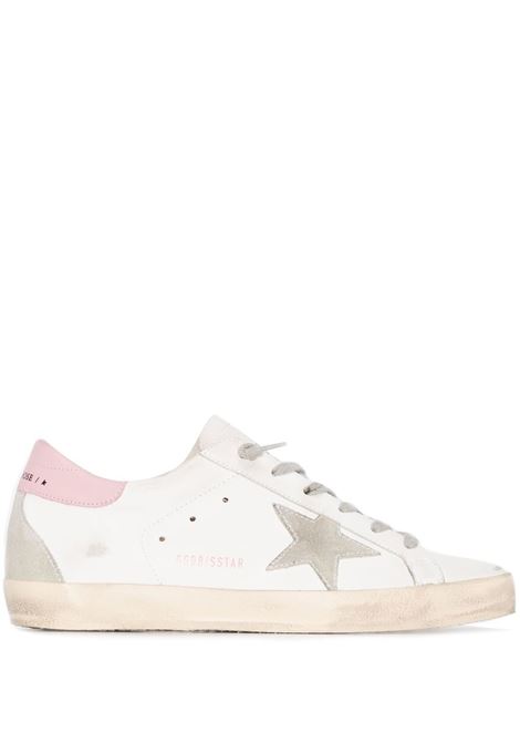 Sneakers Superstar con effetto vissuto in bianco e rosa Golden goose - donna